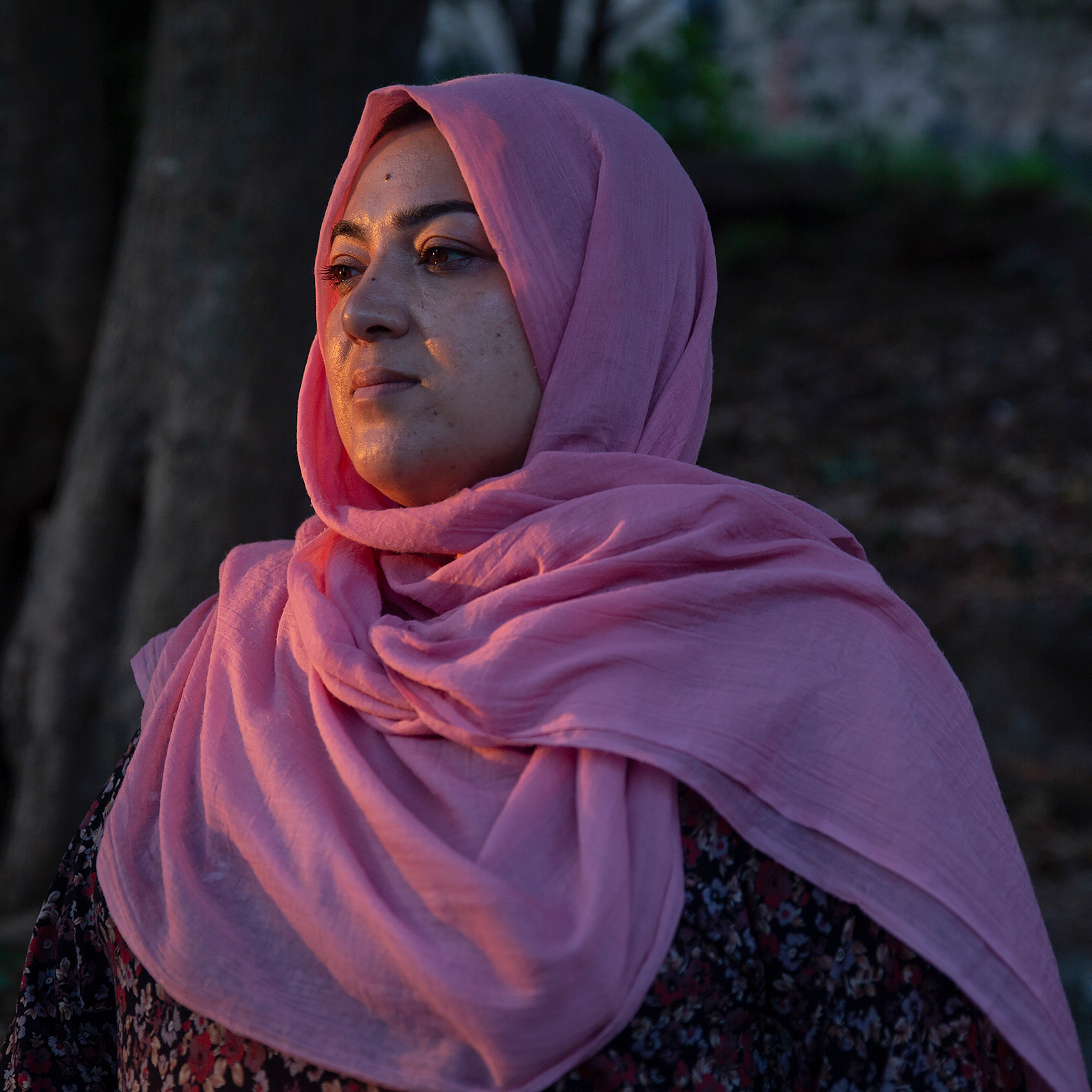 Batool Haidari gazes out at the sunset by her house in Rome
