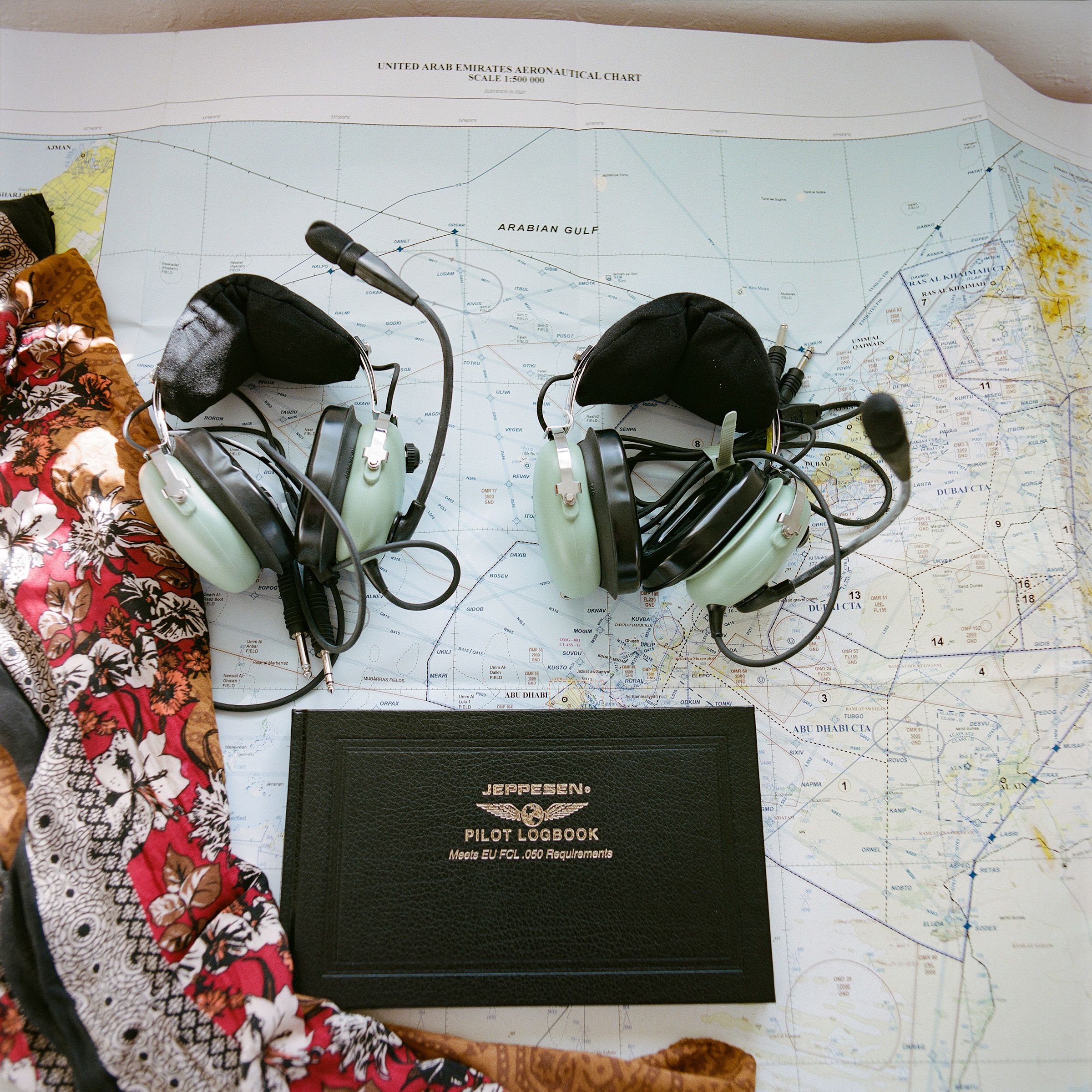 headsets and a pilot logbook