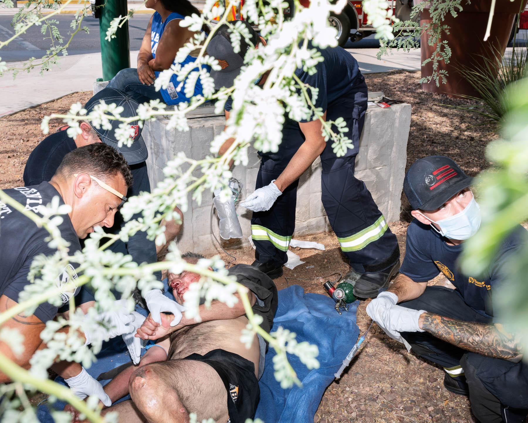 Firefighters from Phoenix Fire Department Station 18 tend to a man who suffered a medical emergency, as well as subsequent burns to his body after falling on the scalding ground, on June 17. The city [experienced](https://www.weather.gov/psr/YearinReview2020) an [