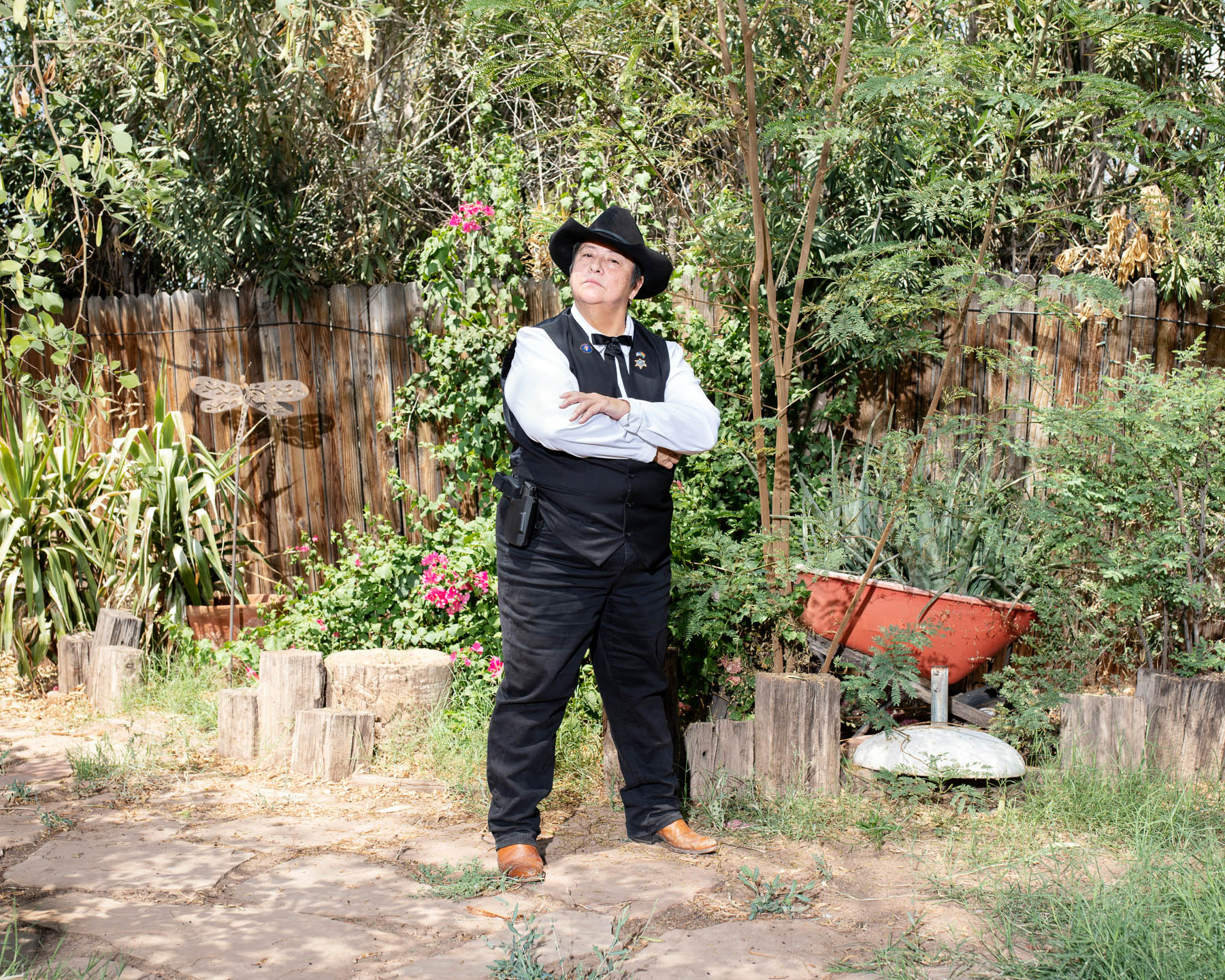 Constable Darlene Martinez has lived in Phoenix long enough—since the mid 1980s—“to see the climate change.” Martinez’s experience back then, as a carpenter who suffered from heatstroke during her first year in Arizona, has informed her approach today when carrying out orders of the court: evictions, warrants, orders of protection and more. “Evicting people in the heat,” she says, “is the hardest thing to do.” But Martinez, who hauls around cases of water in her vehicle, says she makes sure they have a means of transportation and another place to go. In the summer, she starts evictions at around 7 a.m., hours earlier than she did a decade ago. By the end of her day, the clothes under her bulletproof vest are “completely soaked.” Her signature black hat provides shade, but it hasn’t escaped unharmed. “The salt of my sweat wore out the rim,” she says. “After a year, I had to have it replaced.”