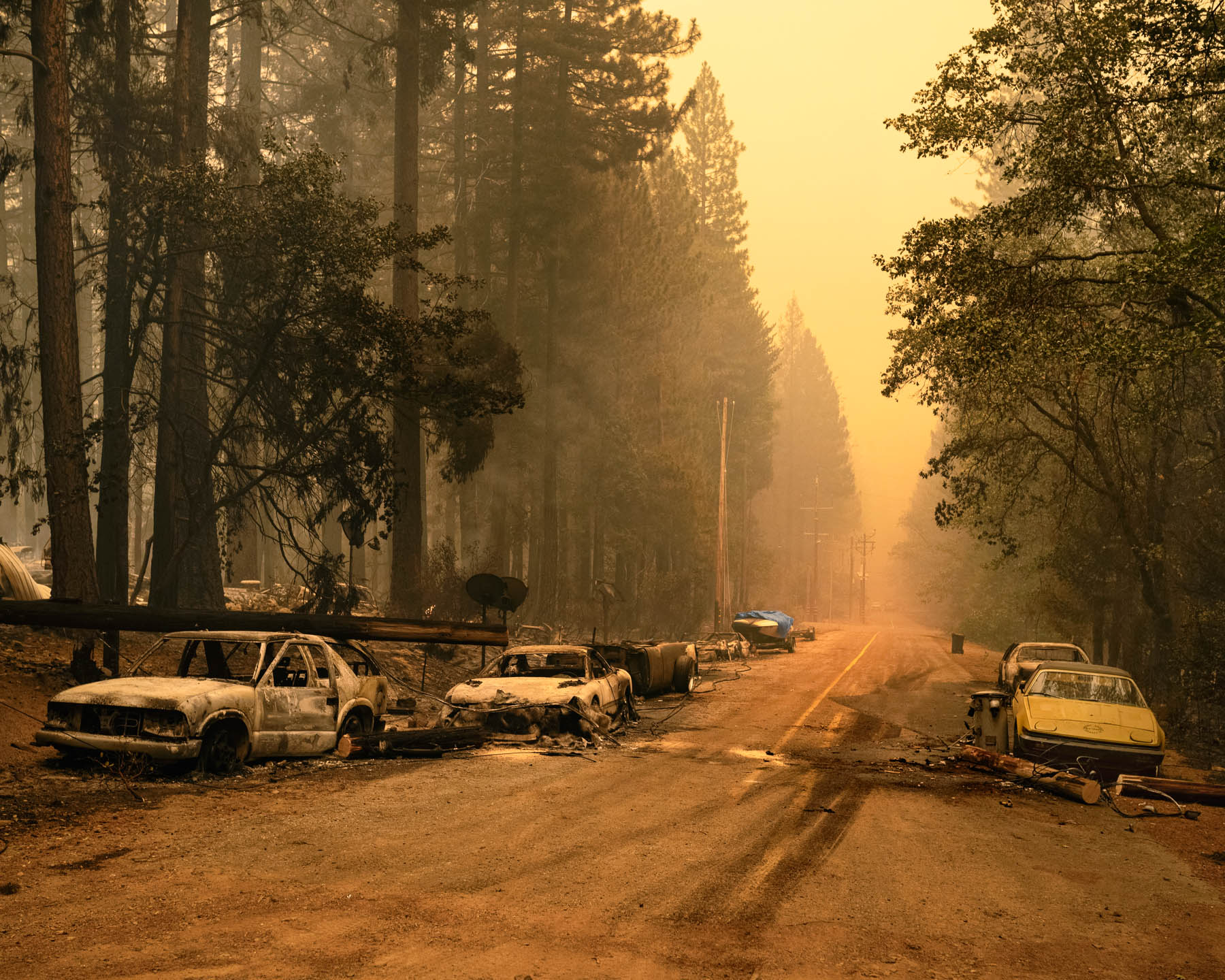 Abandoned vehicles line a stretch of roadway on July 25 after the Dixie Fire burned through the area. As of Aug. 15, per a Cal Fire [tally](https://www.fire.ca.gov/incidents/2021/7/14/dixie-fire/), America's largest wildfire of the year had destroyed more than 1,100 structures. For a time, smoke from the blaze led [Denver's air quality](https://apnews.com/article/fires-environment-and-nature-denver-air-quality-327e529194f8c4c97c88609d0f0858d5) to rank among the world's dirtiest.