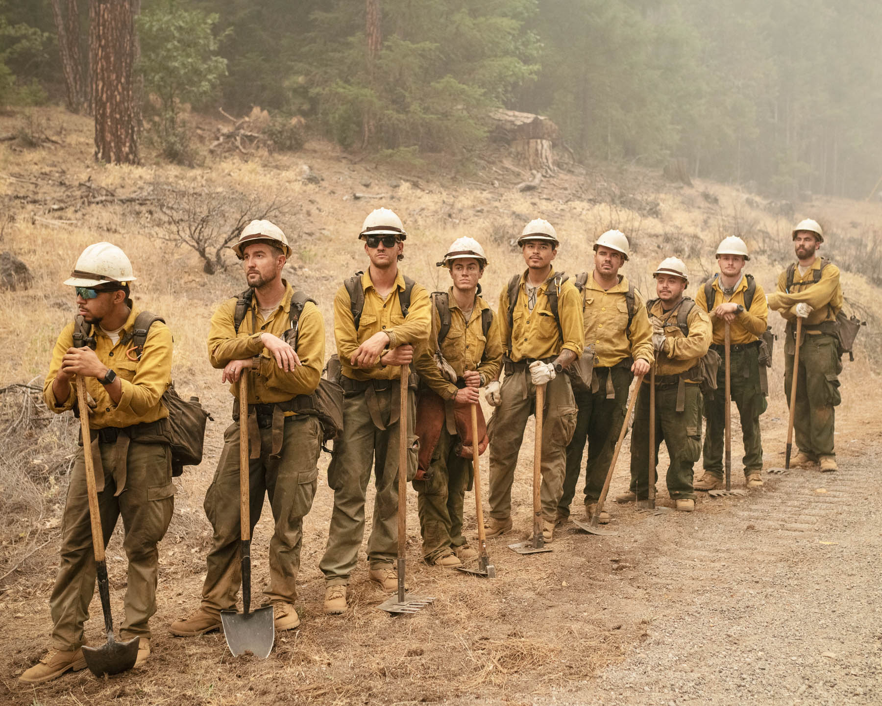 Firefighters stand for a portrait while fighting the Dixie Fire, the largest single fire in California's history, on July 25. The blaze, which [started](https://inciweb.nwcg.gov/incident/7690/) on July 13, had burned more than 554,000 acres by Aug. 15 and was only 31% contained.