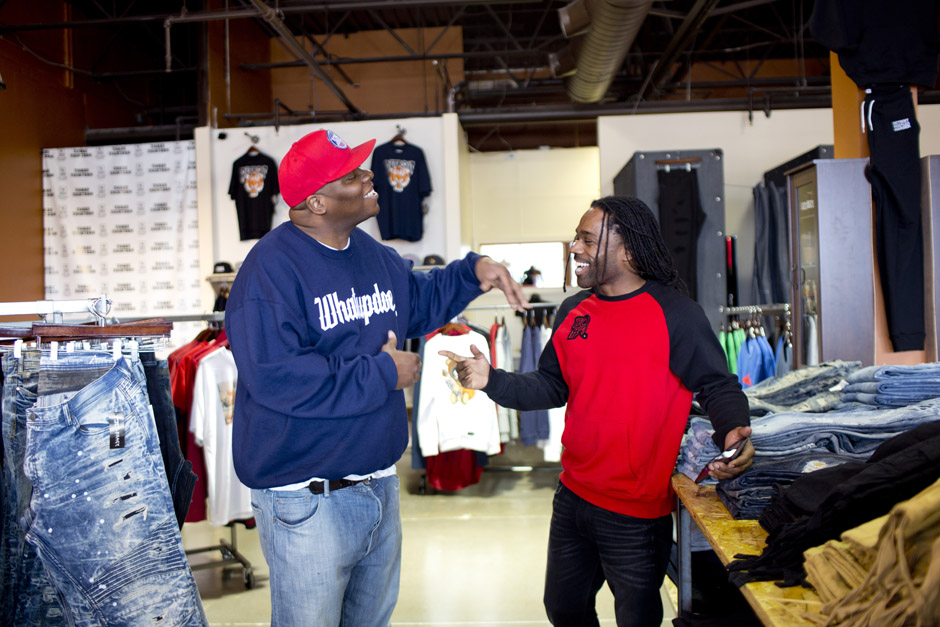 Clement Brown Jr, owner of the boutique Three Thirteen greets Filthy Rockwell, a music producer and entrepreneur.